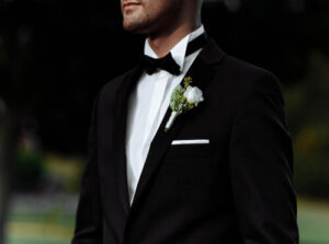 Formalwear vendor at the Rochester Bridal Show offering elegant suits and tuxedos for weddings and special events