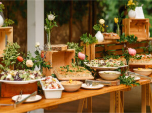 Catering vendor at the Rochester Bridal Show showcasing delicious wedding and event menu options
