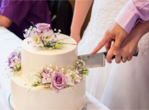 Cakes and sweets vendor at the Rochester Bridal Show showcasing custom wedding cakes and desserts
